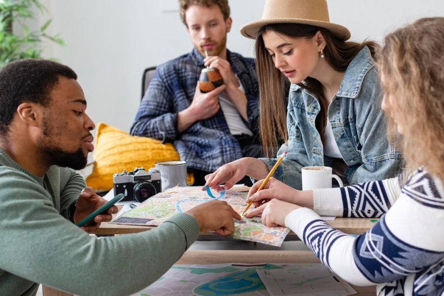 close-up-people-planning-trip_23-2148925846